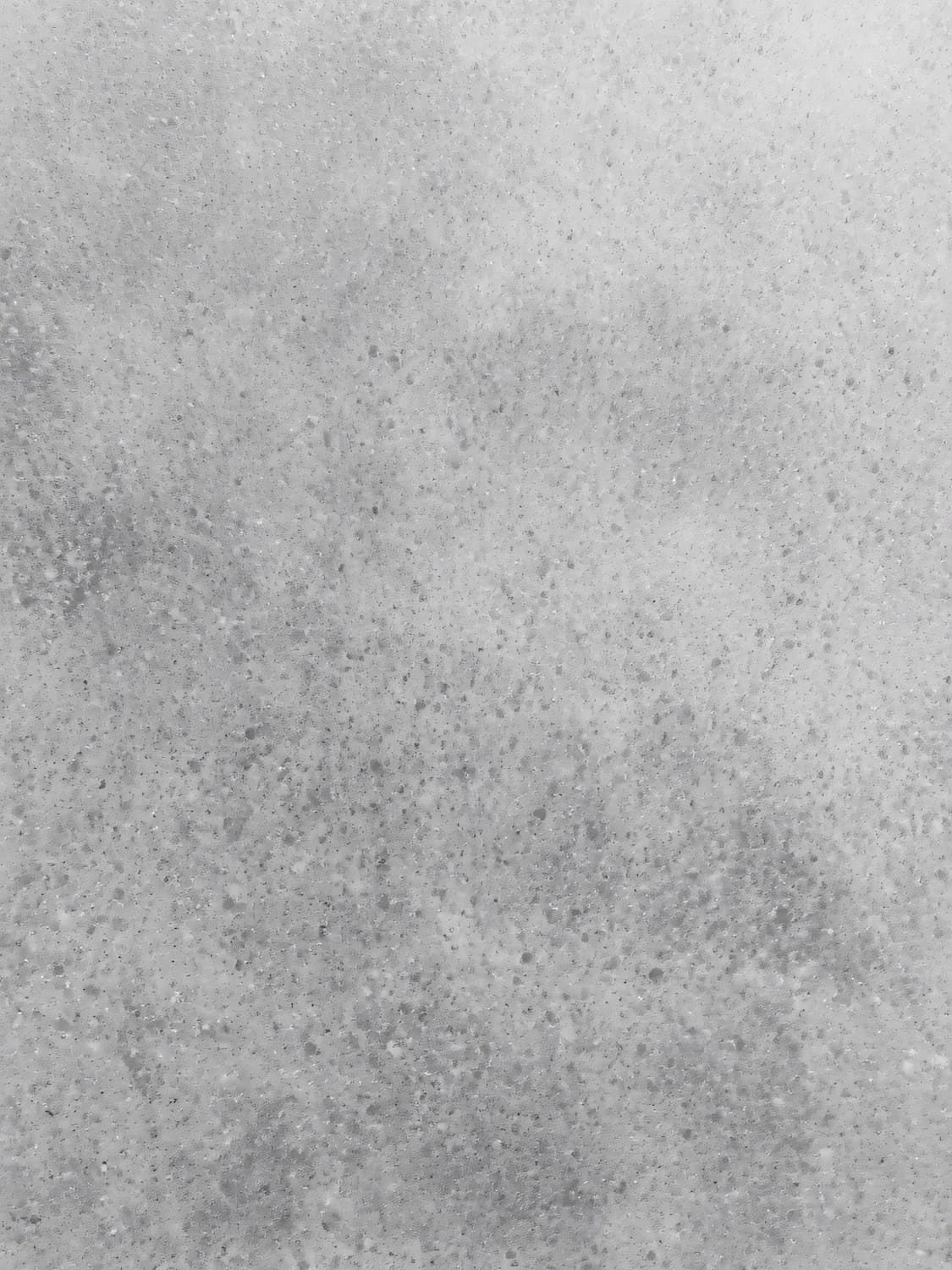 Close up of a speckled grey concrete surface